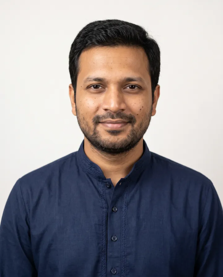 AI résumé photo of the same man in a navy formal kurta on a plain white background